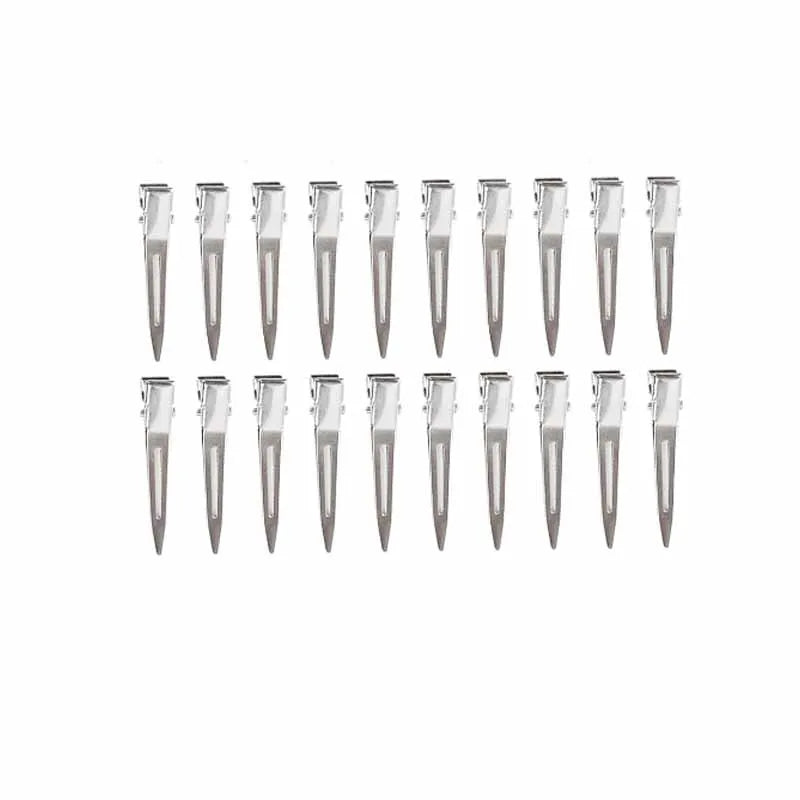 A row of professional fixed hair pins for styling in clear packaging.