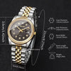 A silver and gold rhinestone quartz wristwatch with a black dial and metal bracelet shown on a dark background.