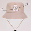 Beige perimeter sun hat with a gold letter A print and a light beige strap