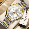 A gold and silver quartz wristwatch with a metal bracelet is displayed on a light-colored box.