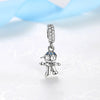 A silver charm featuring a family tree design with blue accents and a diamond-encrusted chain.