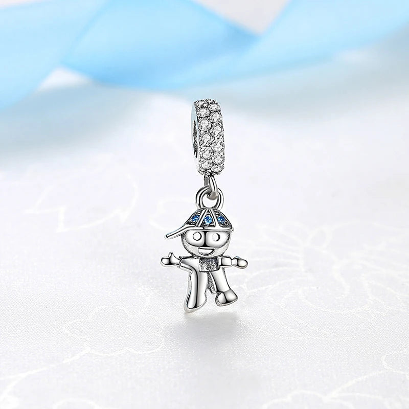 A silver charm featuring a family tree design with blue accents and a diamond-encrusted chain.