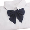 White collared shirt with a navy blue butterfly ribbon tie bow