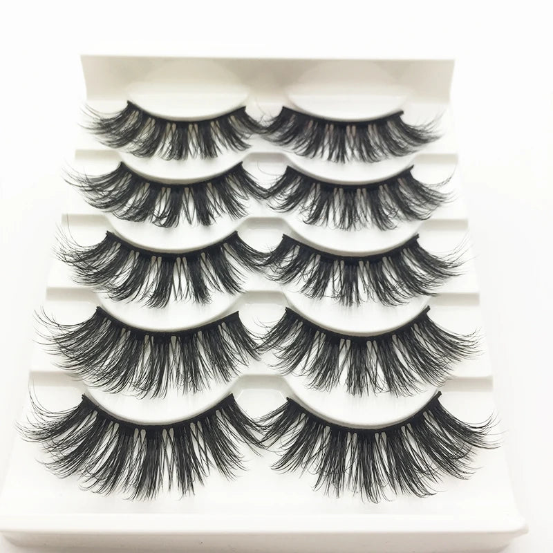A display of handmade 3D mink false eyelashes in various styles and lengths.