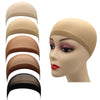 A set of stretch mesh wig net caps in various shades of beige and brown displayed on a mannequin head.