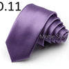 A purple satin neck tie is shown folded and displayed against a white background.