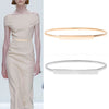 A woman models a beige dress and two versions of a stretchable gold chain waist belt for women.