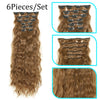 A set of six pieces of 22-inch brown curly wave synthetic hair extensions with clips.