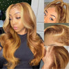 A woman modeling an HD Ombre Honey Blonde Wavy Lace Front Wig with long, wavy hair.