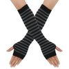 A pair of black and gray striped knitted fingerless gloves crossed on a hand.