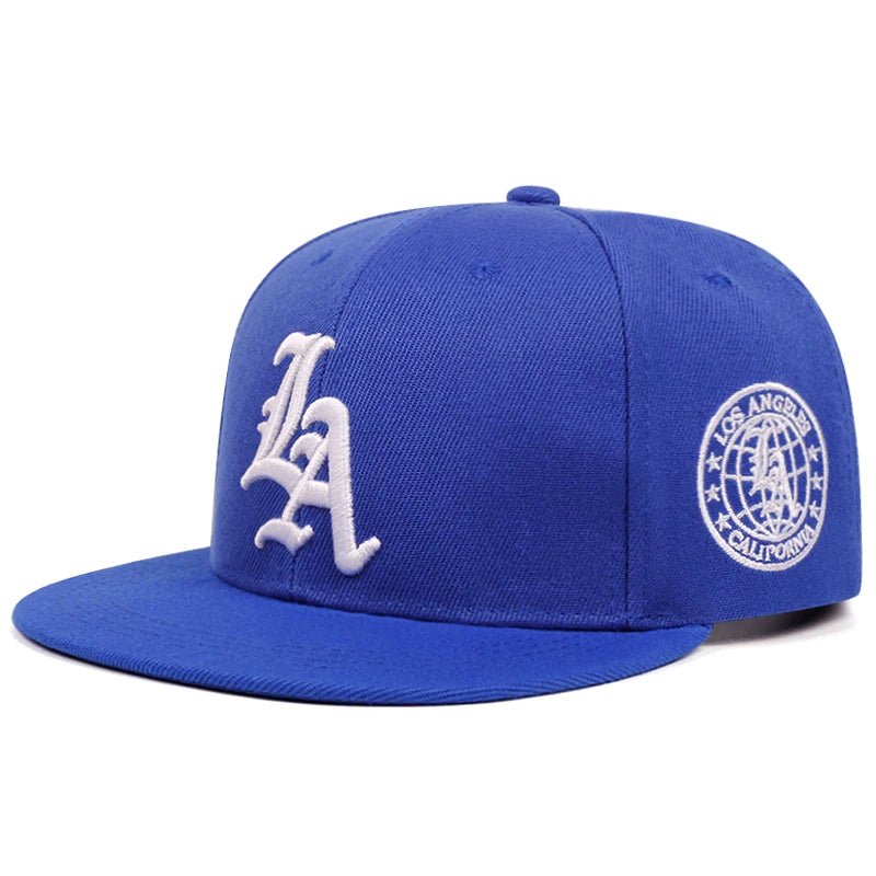 A royal blue embroidered cotton flat edge baseball cap featuring a white LA logo.