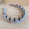 A handmade blue and orange resin wave toothed headband for women
