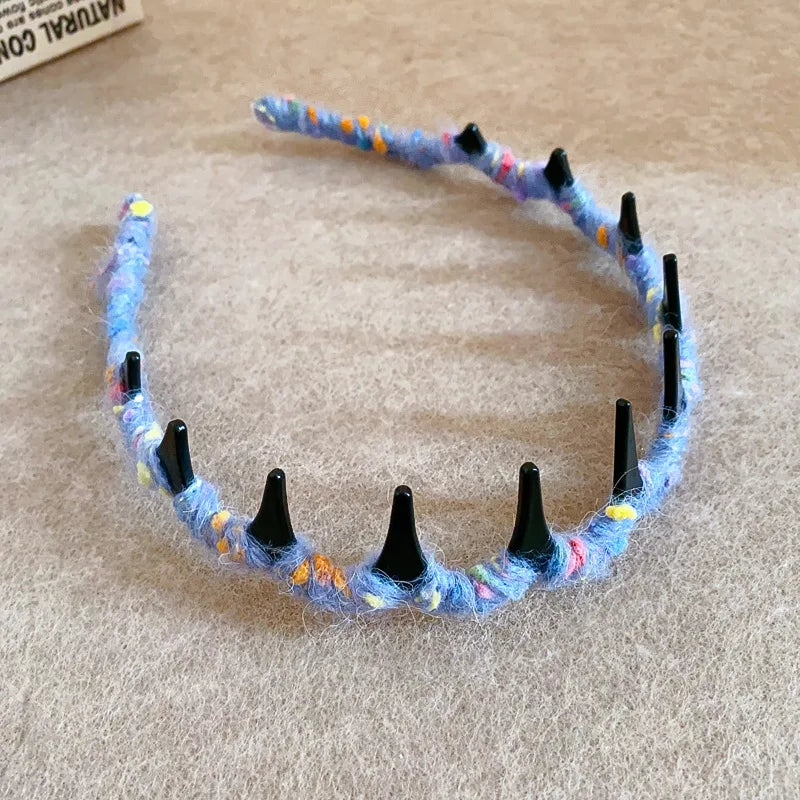 A handmade blue and orange resin wave toothed headband for women