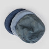 A stack of three retro washed cotton denim beret hats in shades of blue and gray.