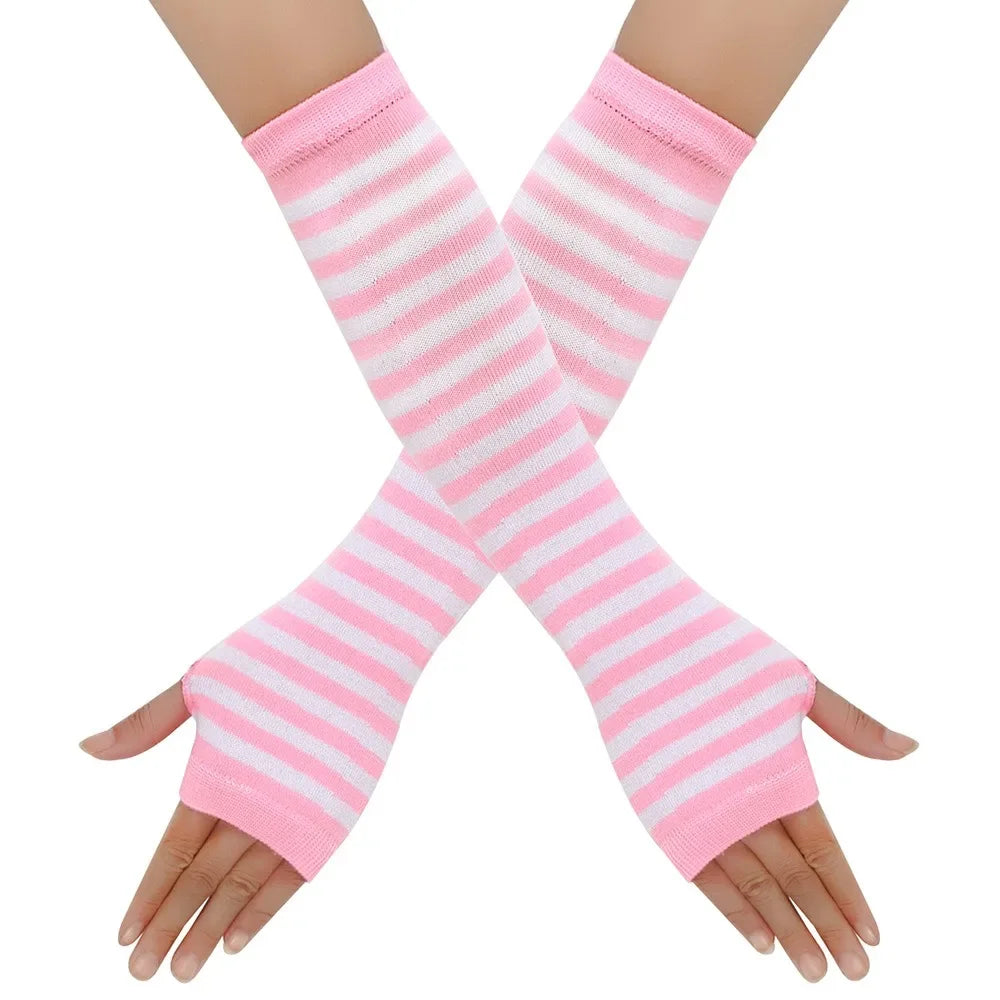 Pair of pink and white striped knitted fingerless gloves worn on a hand.