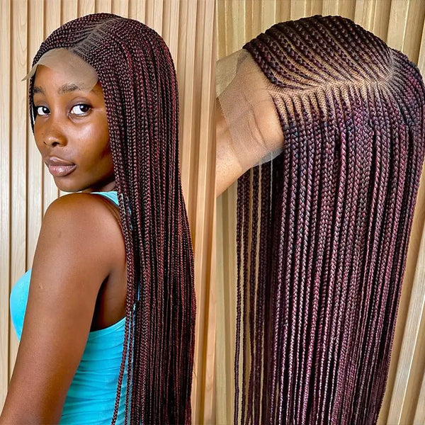 A woman modeling a burgundy full lace braided wig with long, straight hair against a wooden background.