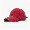 A solid red washed cotton snapback cap shown from the side.