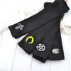 Black knitted fingerless gloves featuring white and yellow symbols on the palm area