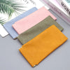 A collection of five pastel and earthy colored PU leather eyewear storage bags arranged diagonally on a gray surface.