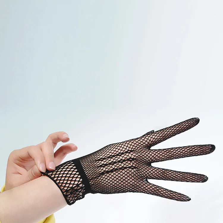 A hand wearing black sheer lace fishnet evening gloves is shown against a light gray background.
