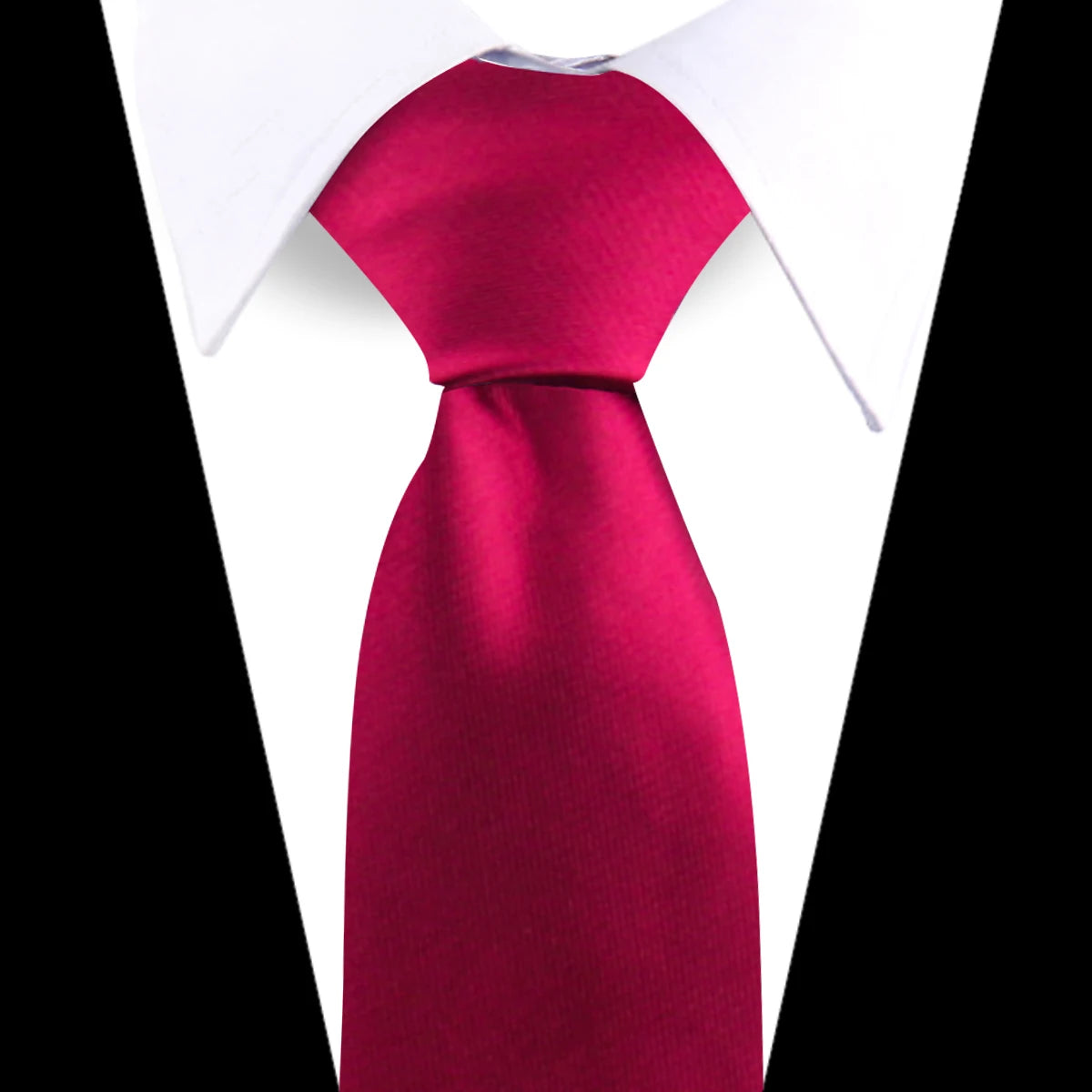A vibrant magenta silk necktie worn under a white dress shirt collar.
