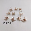 A set of ten mini hollow butterfly metal hair clips in silver tone arranged on a white background.