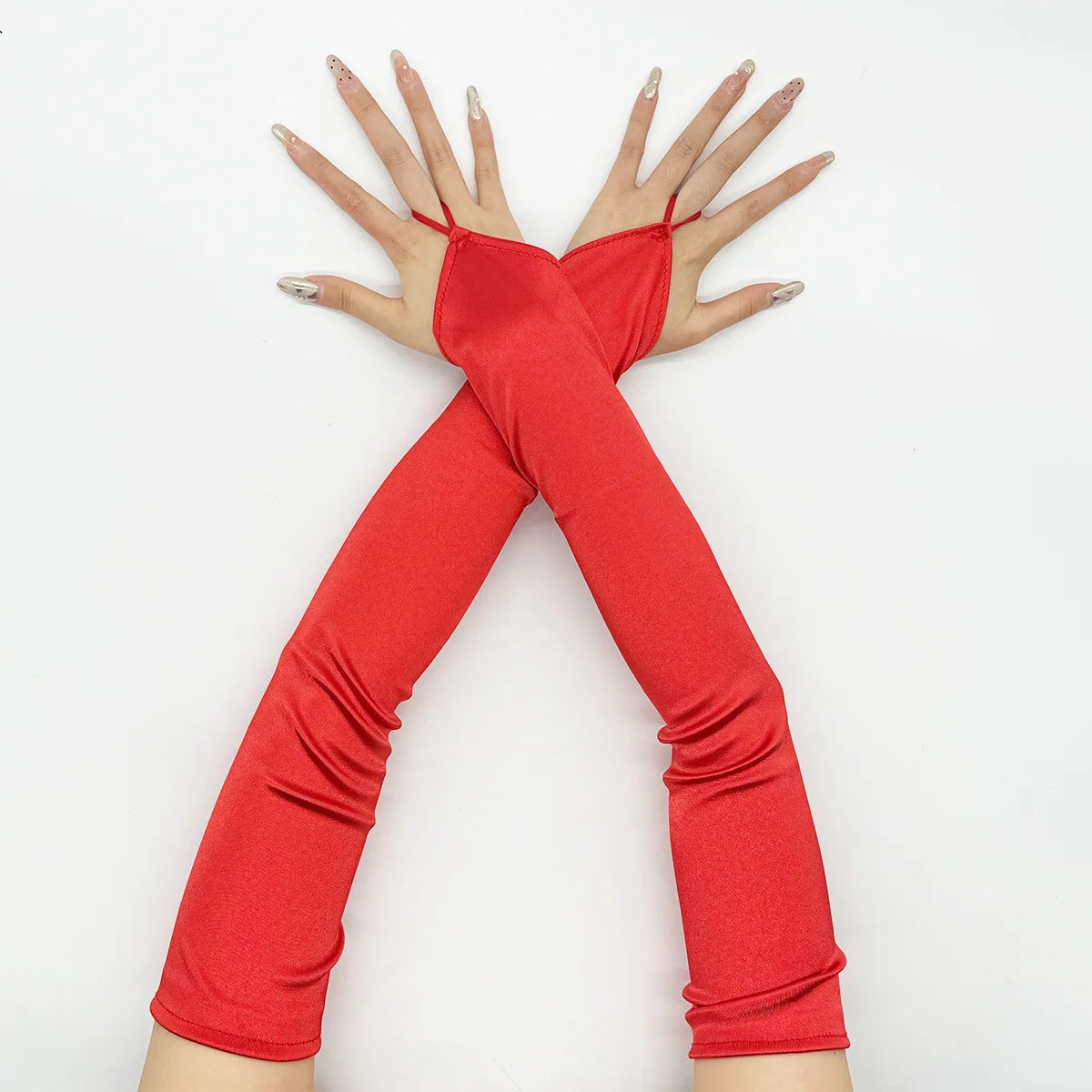 A pair of red satin fingerless gloves worn on the hands, posed with fingers spread.