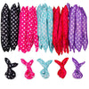 A set of ten flexible hair curling rollers in various shades of pink, purple, and teal.