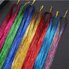 A collection of rainbow glitter hair extensions in various vibrant colors like pink, green, blue, and red.