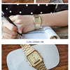 A collection of Casio watches, including a gold military style wristwatch and a silver-toned watch on a wrist.