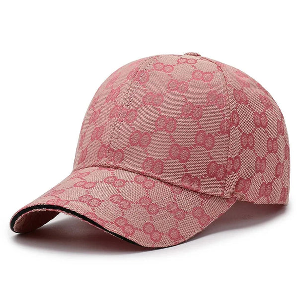 A pink men's cotton baseball cap featuring a repeating dot pattern.