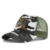 A camouflage baseball cap featuring a black and white pattern with yellow lettering on the front.