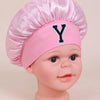Pink sleep cap for kids with a large black letter Y embroidered on the front