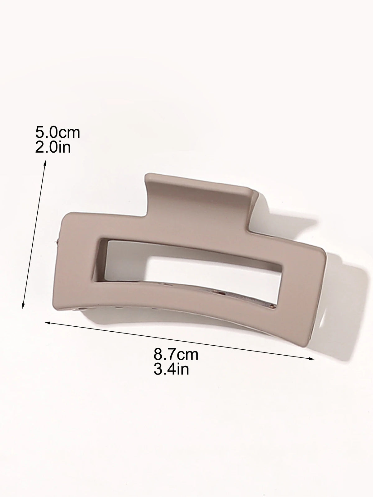 A beige square hair claw clip shown with dimensions 5.0cm (2.0in) and 8.7cm (3.4in).