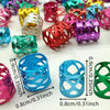 A collection of multicolor dreadlock hair rings in various shades and sizes.