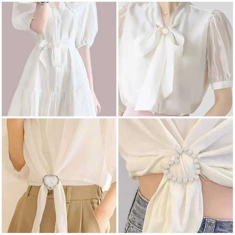 White silk blouse with decorative rhinestone and pearl button clips and a flowing bow detail