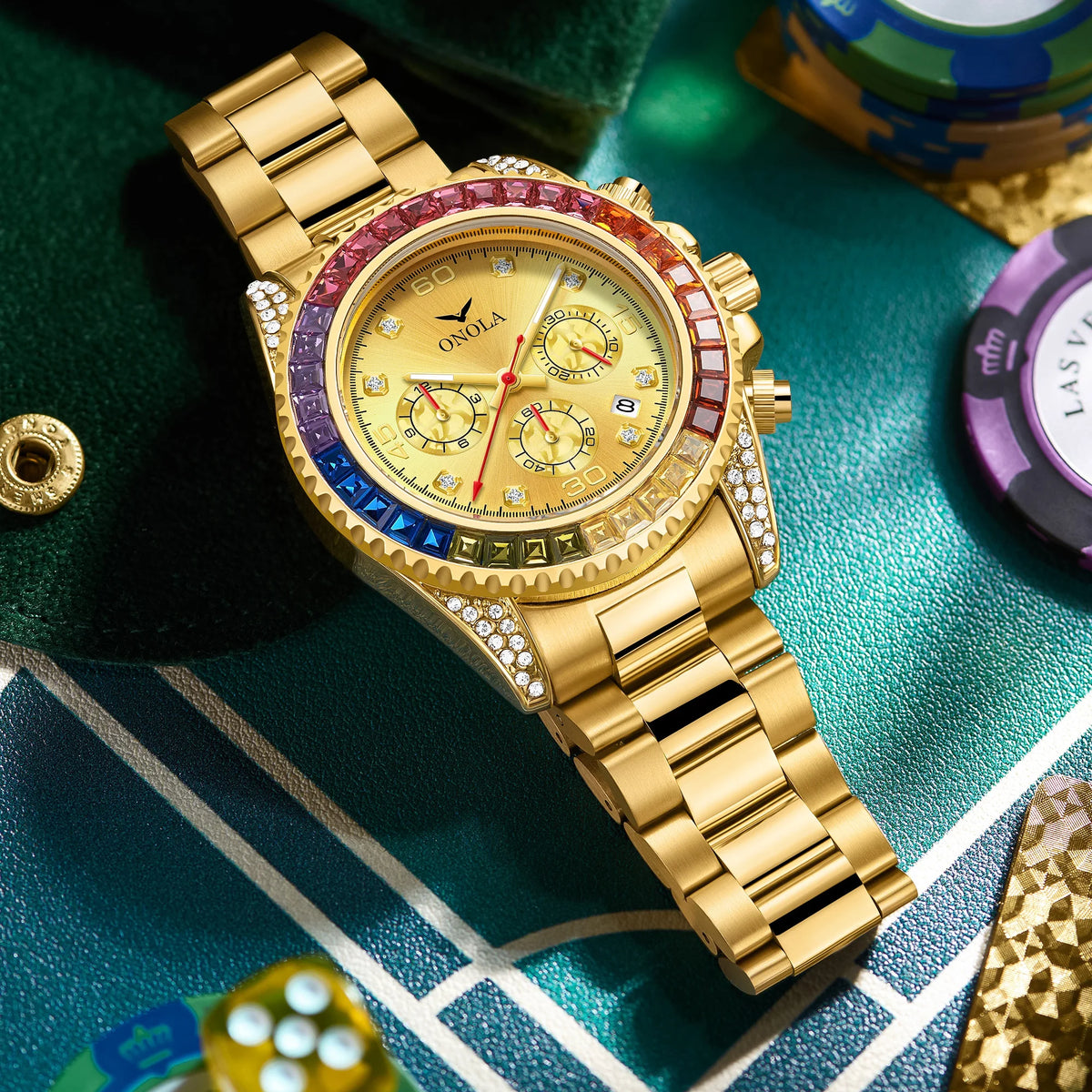 A gold quartz watch with diamond accents is displayed on a green surface.