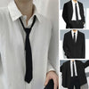 A white dress shirt with a black clip-on tie shown alongside a black suit jacket and trousers.
