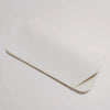 A white PU leather glasses case folded and lying on a light surface.