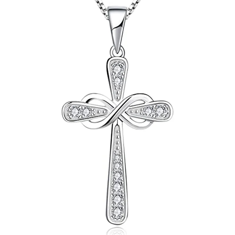 A silver cross pendant necklace featuring an intertwined design and a detailed cross shape.