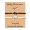 A pair of dark gray knitted pinky promise bracelets for couples with a heart knot design.