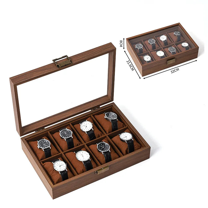 A wooden multi-slot display box for watches and jewelry, showing various timepieces inside.