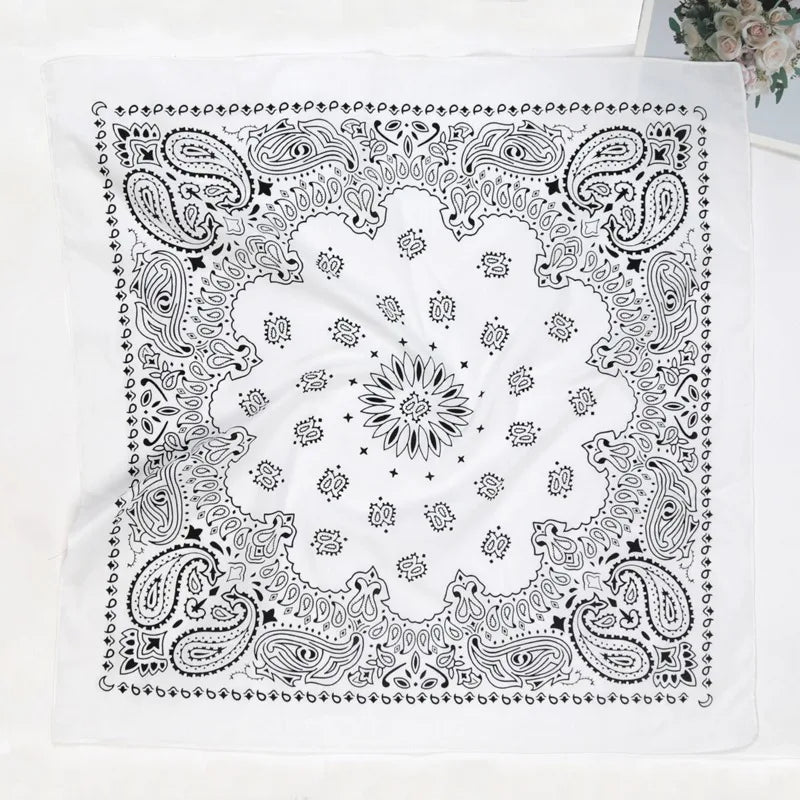 Black and white paisley bandana scarf featuring intricate floral and swirling patterns on a white background