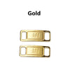 Gold metal shoe charms and laces labeled AF1