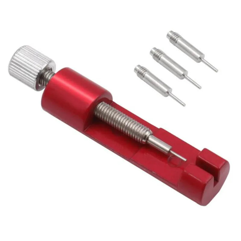 A red precision metal watch strap adjuster tool with multiple adjustment pins.