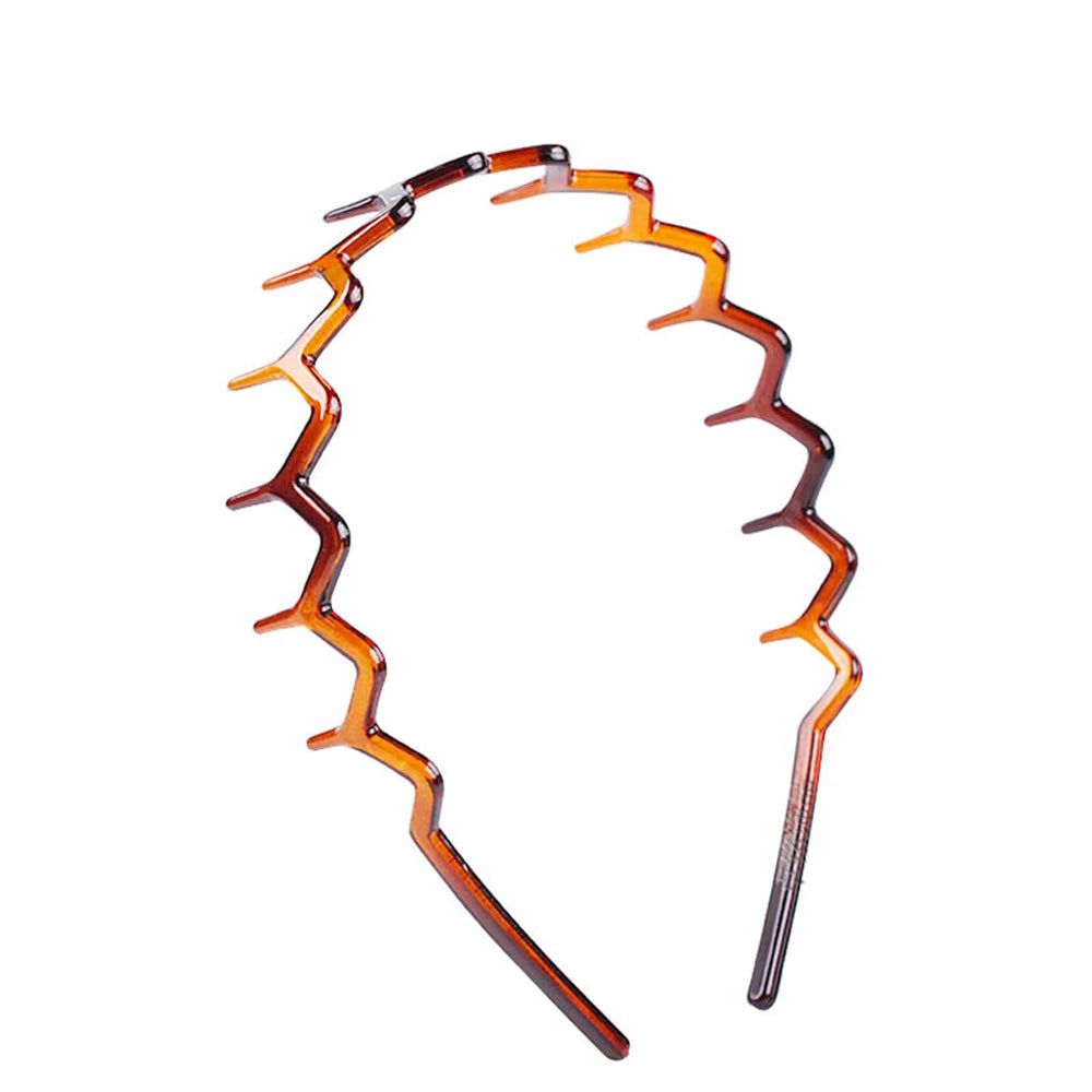 An orange zigzag headband hair comb used for face concealment.