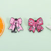Pin de estetoscopio de esmalte con lazo rosa, cinta y símbolos médicos