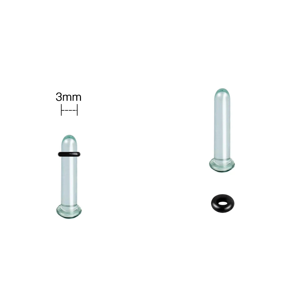 A glass ear stretching kit showing a 3mm tube, a larger glass piece, and a black plug.