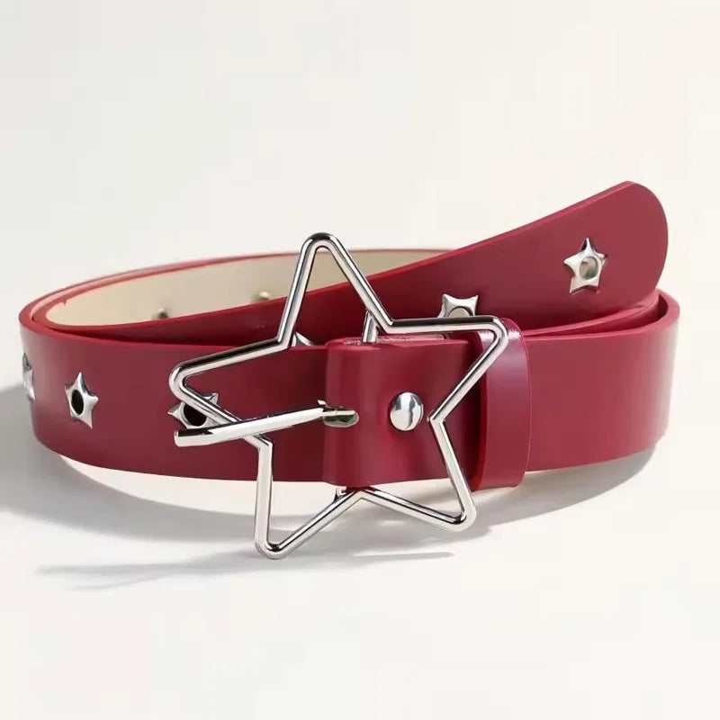 A close-up of a red belt with silver star rivets and a star-shaped buckle.