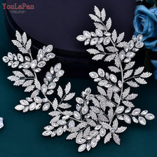 Accessoire de mariage en strass argentés avec des motifs floraux et de feuilles complexes